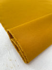 Tissu en coton épais adouci jaune moutarde par cour 400/m2 - Rembourrage de style français - Tissus d'ameublement naturels. %100 Coton - 150 cm de largeur. Gabardine de coton.